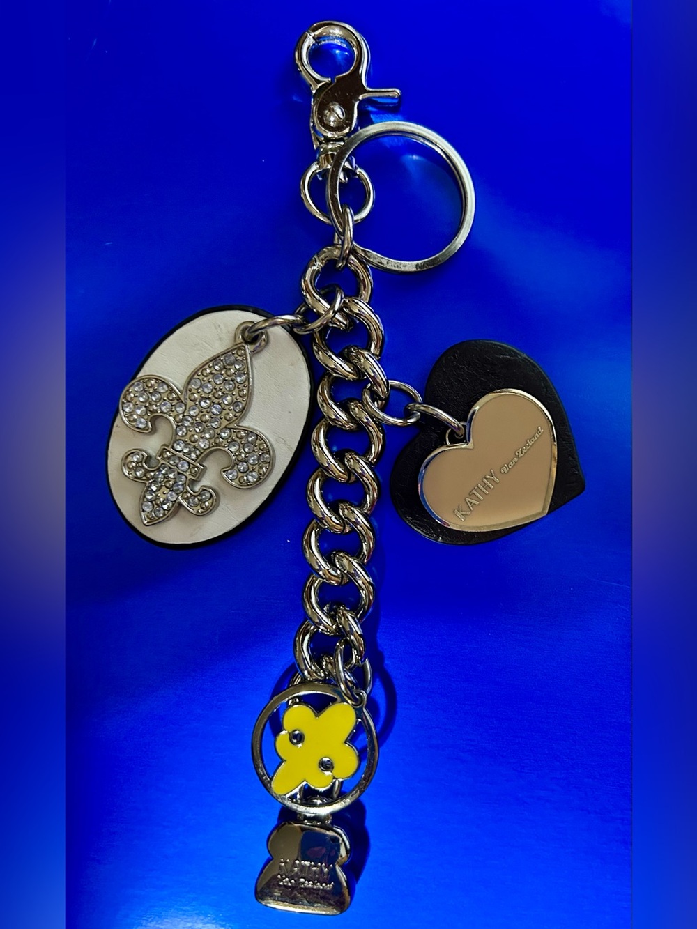 Kathy Van Zeeland black, white & yellow charm keychain with gold accents